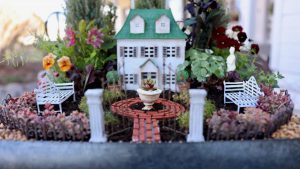 Front view of the house in a mini garden layout